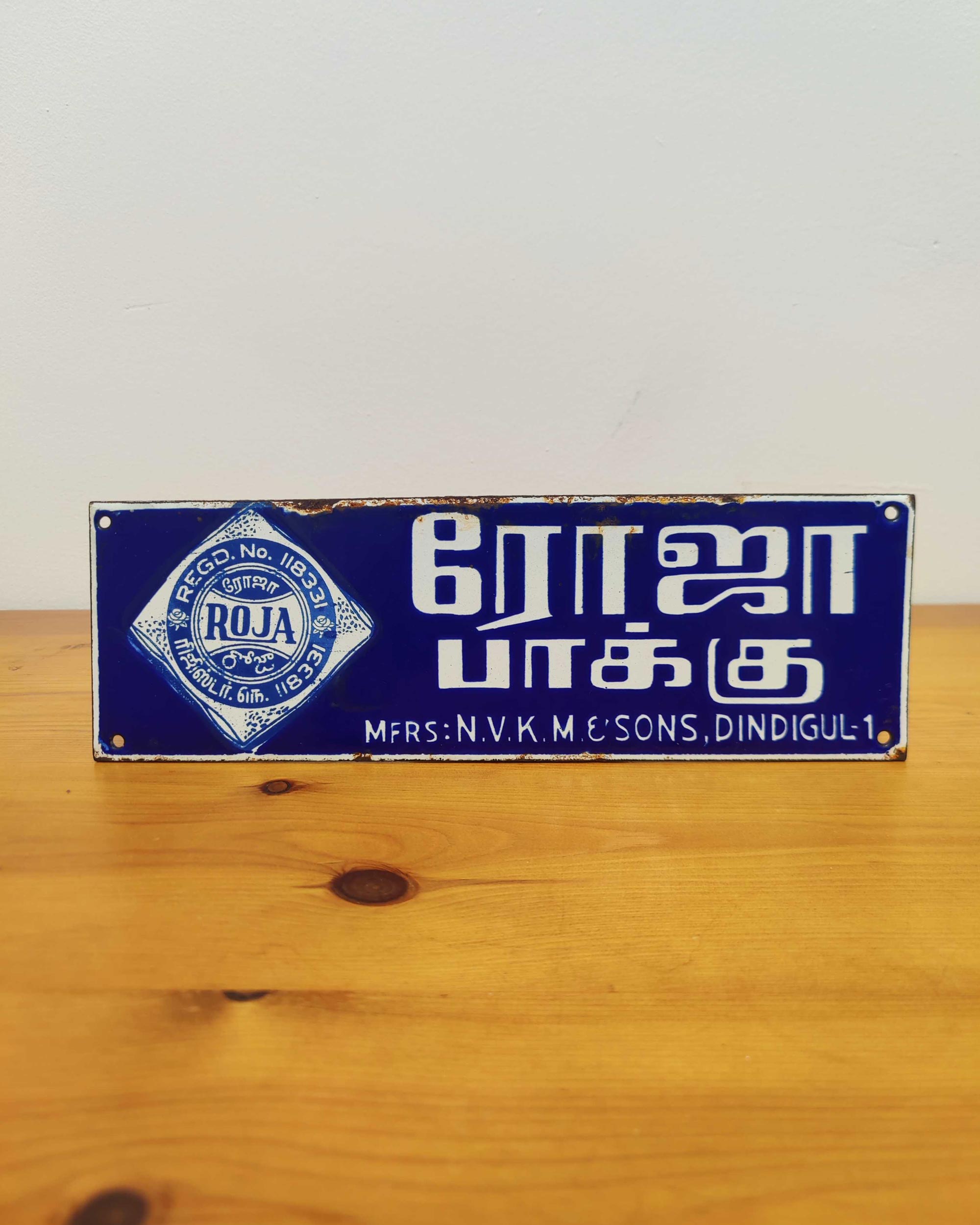 Roja Pakku Vitreous Enamel Advertising Sign c.1960 | Two Giants